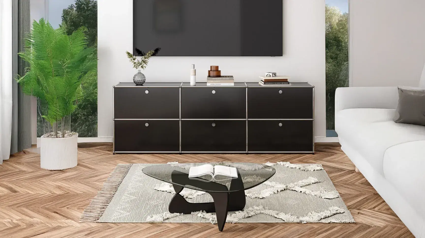 Minimalist living room with Sohnne Haller Sideboard H2 Replica and a Noguchi Table Replica on a patterned rug